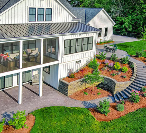 Curved Stairway Connects Layered Landscape